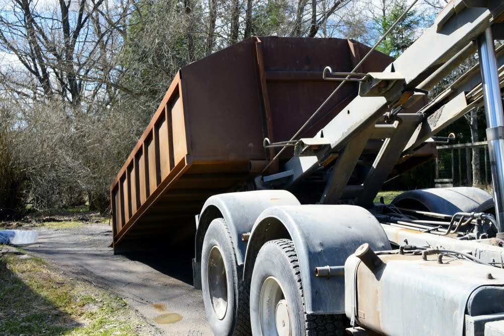 Delivery of a roll off dumpster rental in Mobile, AL