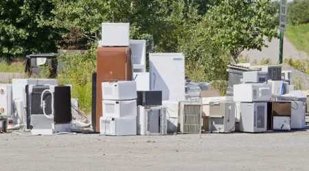 Old appliances in need of a large dumpster rental Mobile, AL